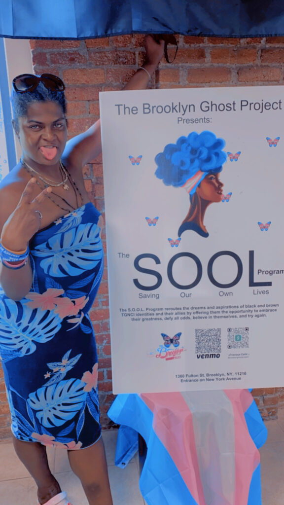 Posing with a S.O.O.L Sign