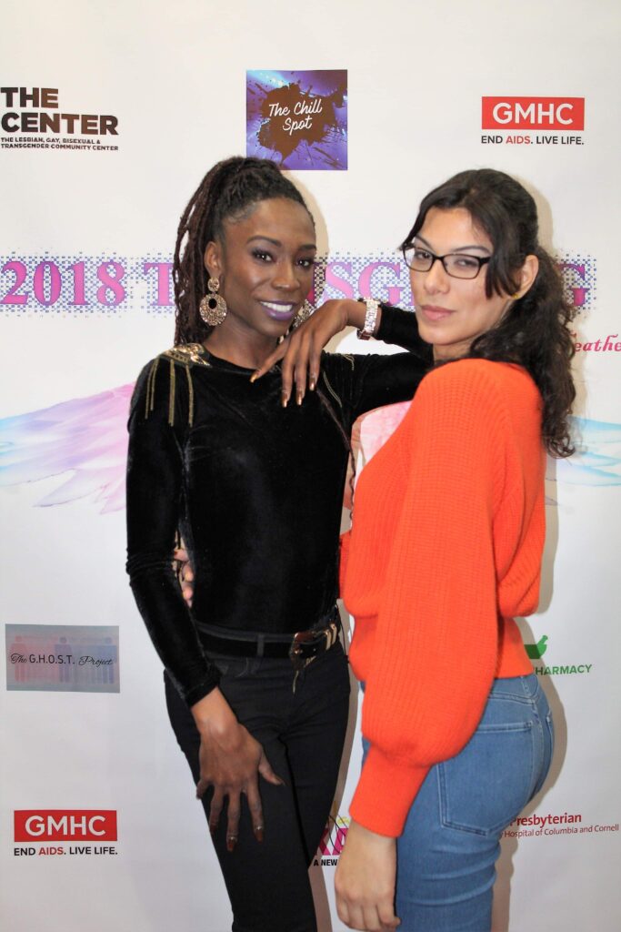 Two People Posing at an Event